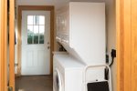 Stackable washer and dryer in the mudroom